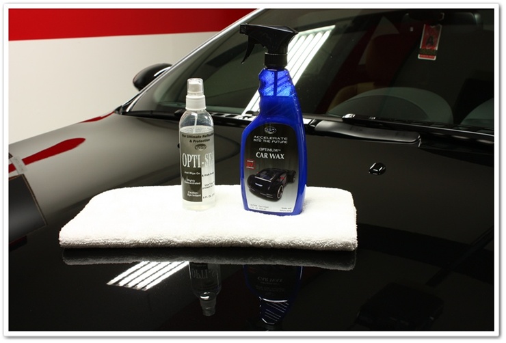 Optimum Opti-Seal and Car Wax ready to be applied to a black 2008 BMW M6