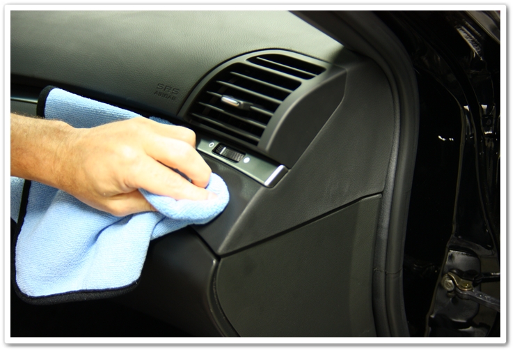 Applying Optimum Protectant Plus with a microfiber towel on an Acura TL interior