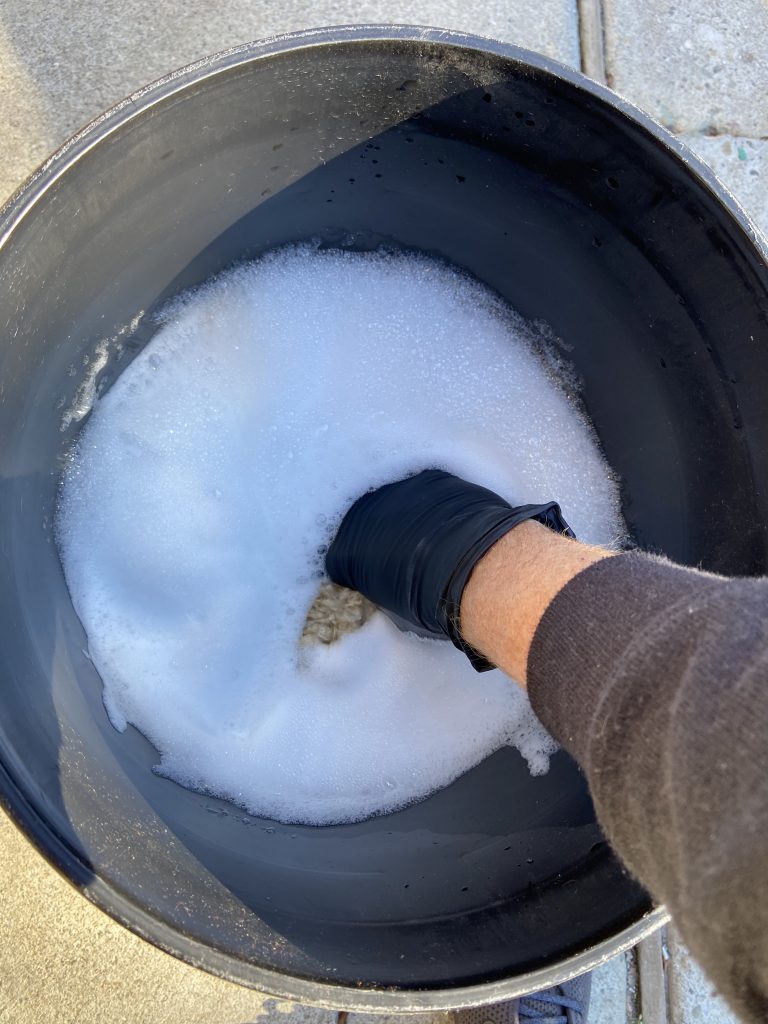 Winter washing tips hand in buck