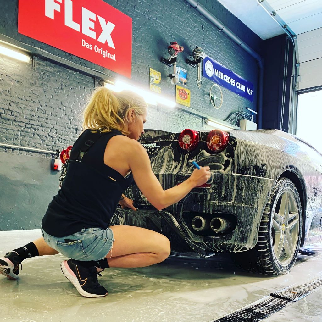 Justyna Brys of JB CarDetail cleaning a Ferrari F430
