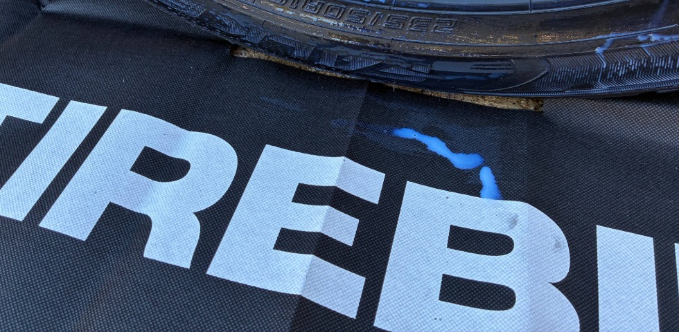 Driveway Shield TireBib protecting from Tire Dressing Spills