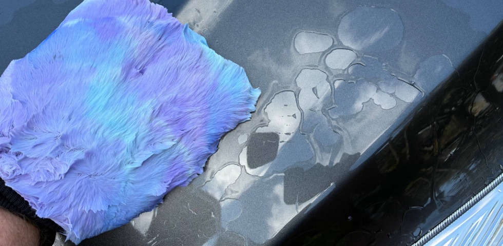 Applying Bilt Hamber Touch On with a wash mitt to vehicle panel