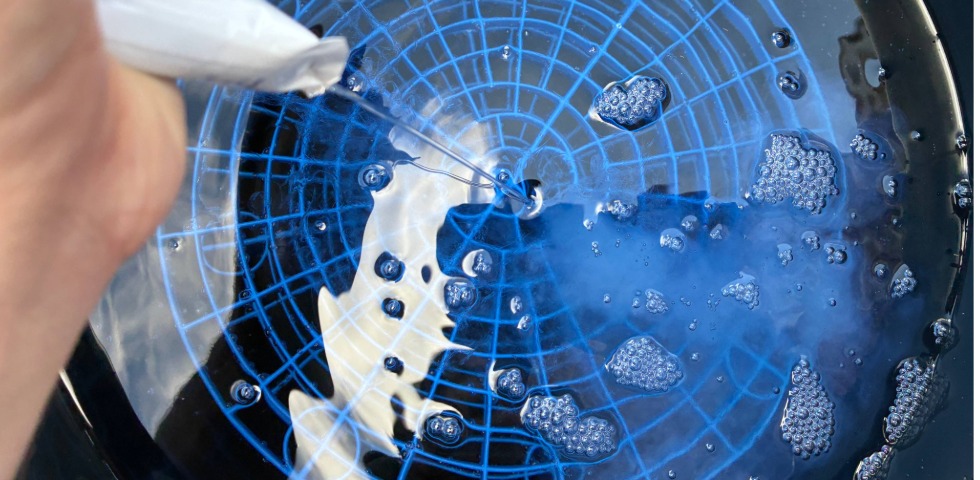 Squeezing Touch On Packet into Wash Bucket