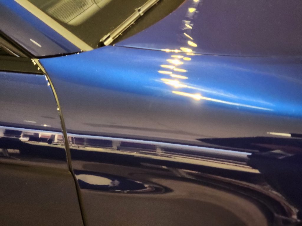 Blue Porsche At The Dealership