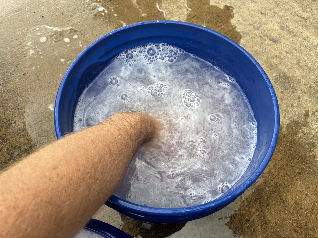 Dipping Mitt into Rinse Bucket