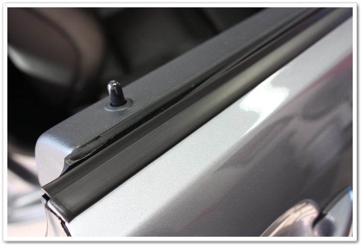 Window trim treated with Leatherique Prestine Clean on a 2005 BMW M3