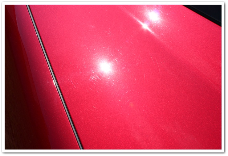 Swirls on a newly delivered 2008 Cyrstal Red Metallic Chevy Corvette prior to properly detailing