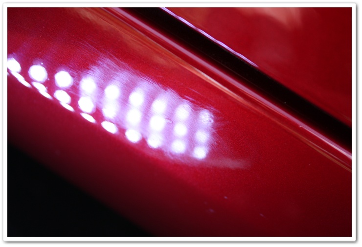 Unpolished paint on a newly delivered 2008 Chevy Corvette in Crystal Red Metallic