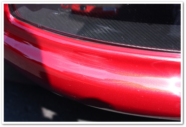 Swirls on a newly delivered 2008 Cyrstal Red Metallic Chevy Corvette prior to properly detailing