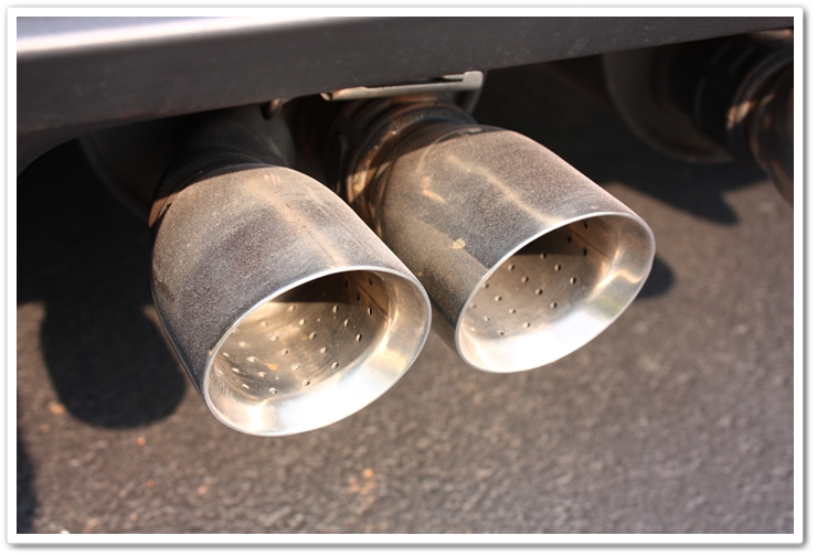 Exhaust tips on a newly delivered 2008 Chevy Corvette prior to polishing