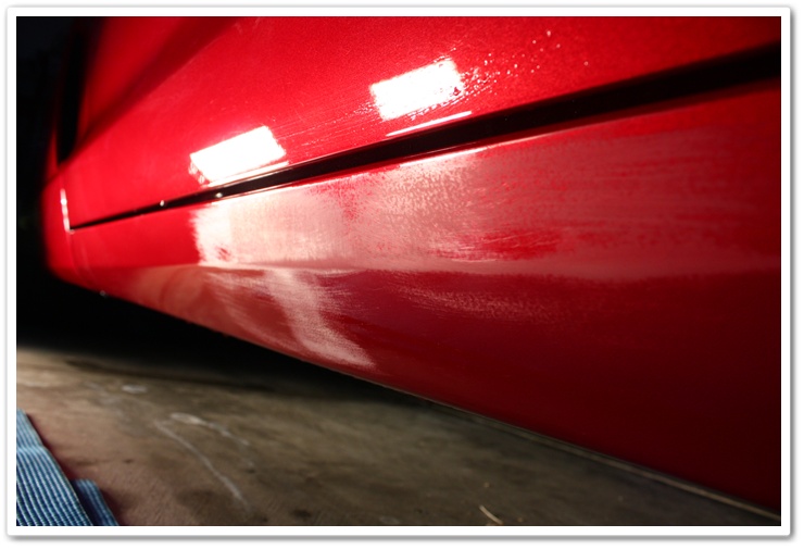 Rocker panels of a 2008 Chevy Corvette wetsanded to remove imperfections