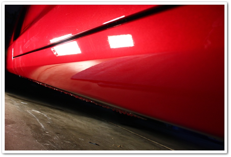 Rocker panels of a 2008 Chevy Corvette after wetsanding and polishing
