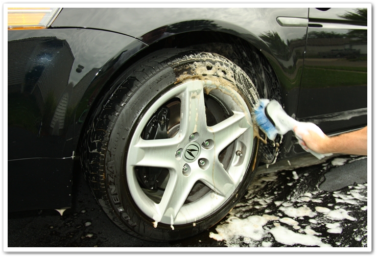 Scrubbing the tires with Optimum Power Clean and a brush