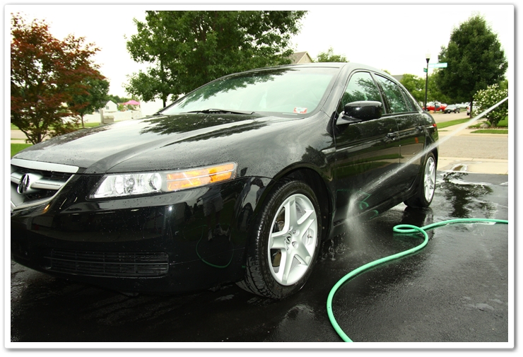 Pre-rinse lower panels to remove dirt and debris prior to washing a 2007 Acura TL in NBP