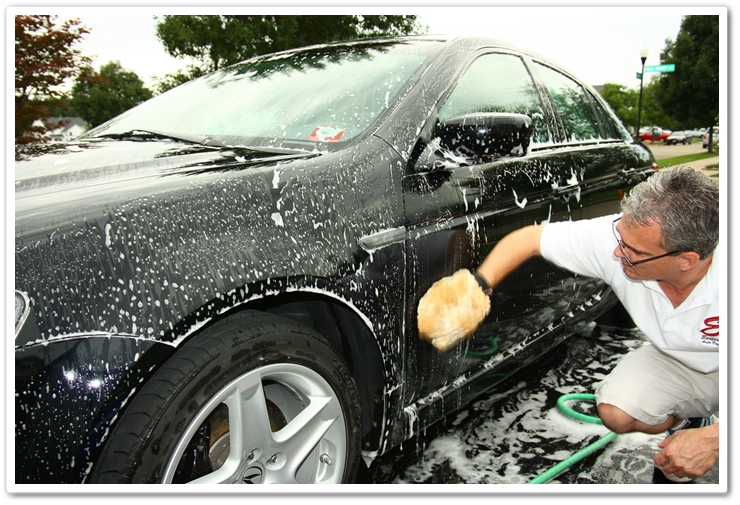 Washing the upper panels of a 2007 Acura TL using a sheepskin wash mitt and Citrus Wash and Clear