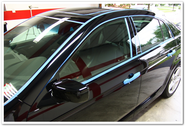 Taped up trim on a 2007 Acura TL prior to polishing in an Esoteric Auto Detail