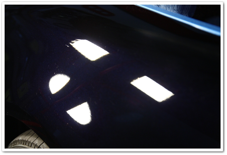 Corrected fender of a 2007 Acura TL in NBP after 1 pass of Power Finish on an orange pad