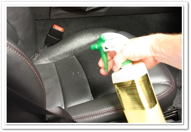 Spraying Leatherique Prestine Clean on Chevy Corvette seats