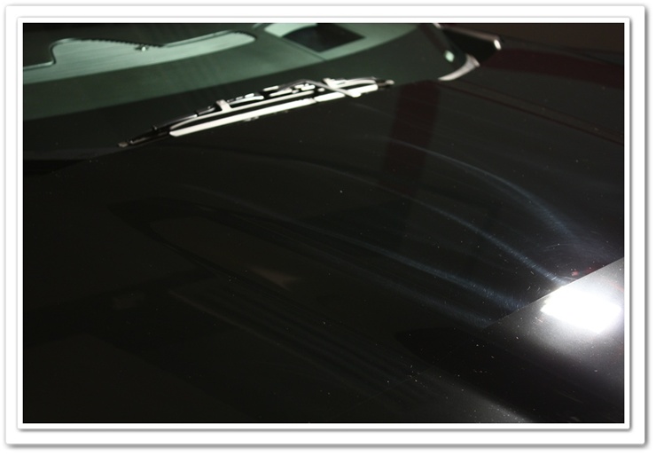 2008 black Chevy Z06 Corvette with hazing and holograms from dealer prep