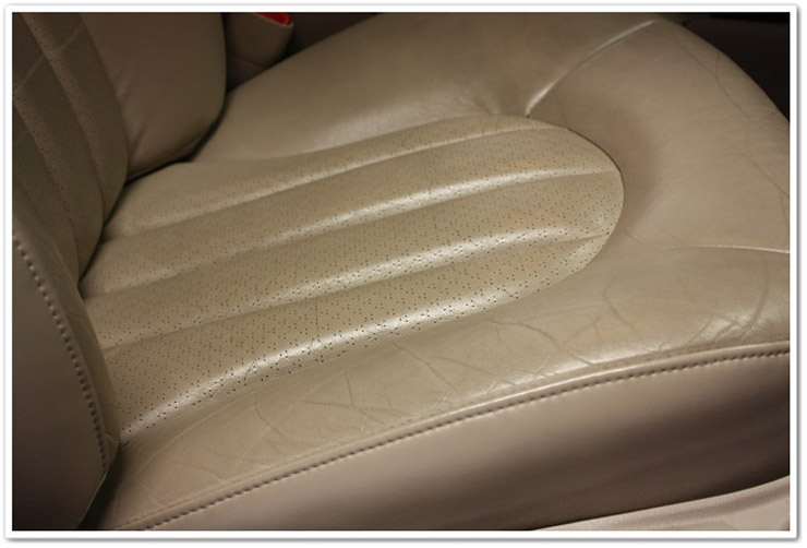 Passenger seat before Leatherique leather restoration