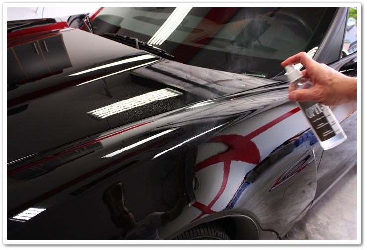 Optimum Opti-Seal misted onto paint for application on a black Corvette